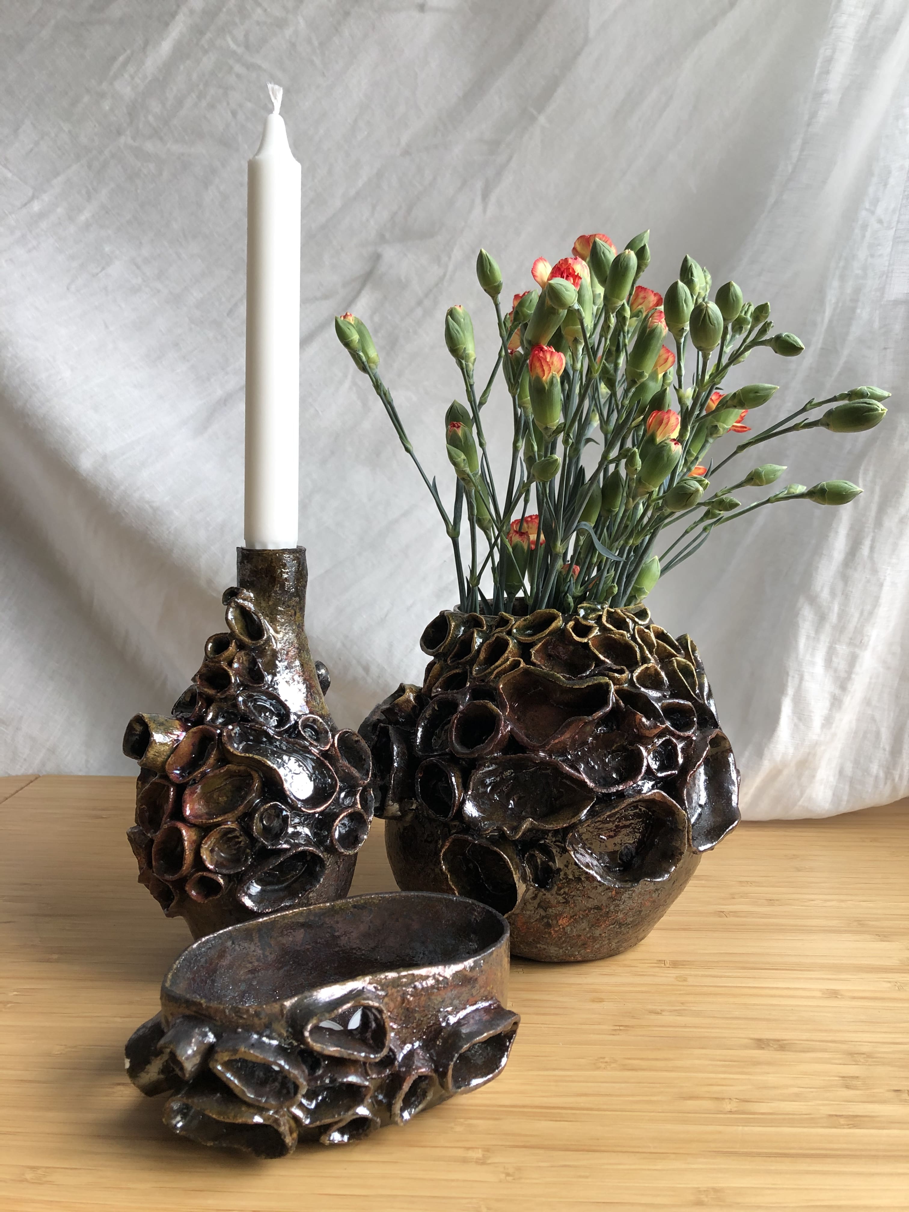 ceramic flower vase, candle holder and a bowl, made in japanese raku technique
